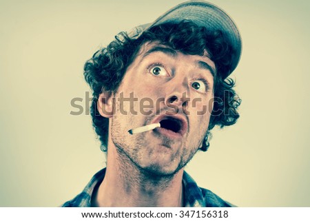 stock-photo-amazed-redneck-has-just-had-his-mind-blown-as-he-smokes-a-cigarette-347156318.jpg